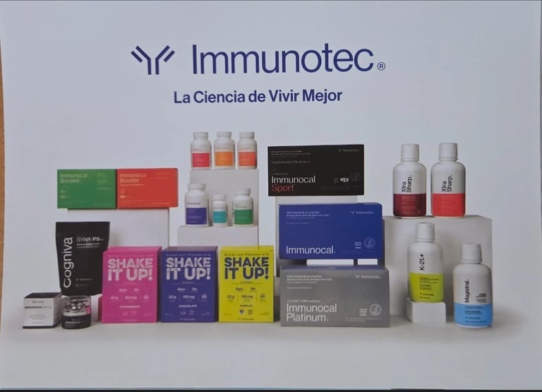 Immunotec product line display featuring shake bottles, supplements, and skincare items with company logo and tagline